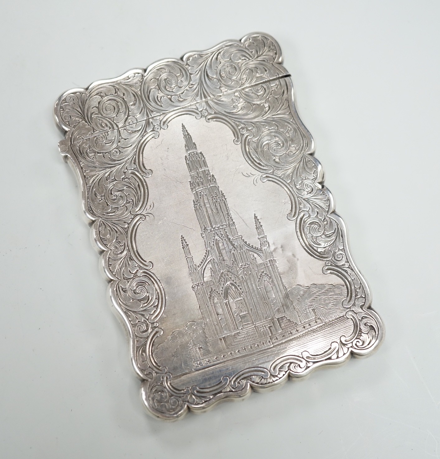 A Victorian silver card case by Nathaniel Mills, the front panel engraved with The Scott Memorial, Birmingham, 1848, 9.9cm.